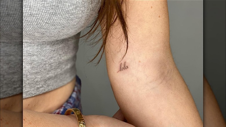 woman with name dainty tattoo