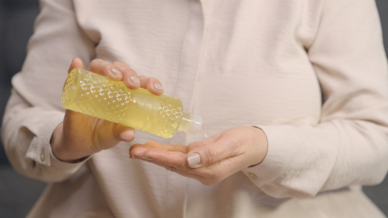 Woman pouring lemon juice