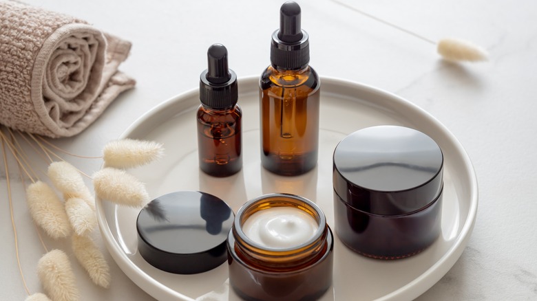Different skincare products on a tray