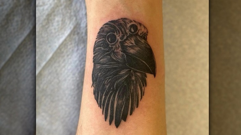 crow tattoo on arm