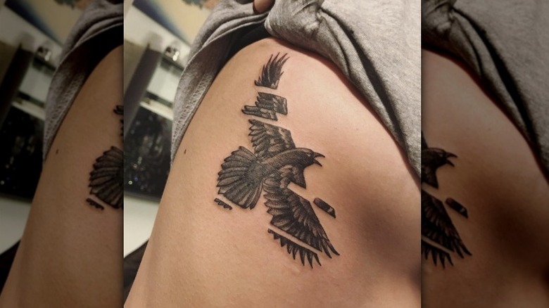 crow tattoo on ribs