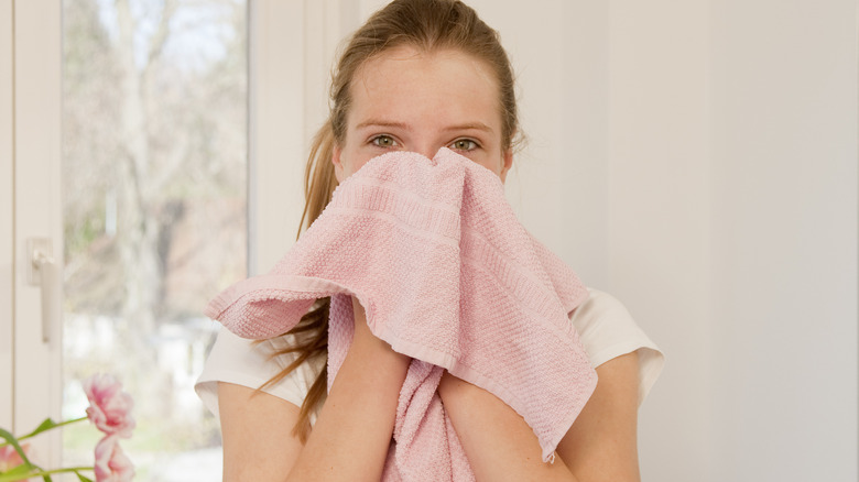 lady with towel on her face