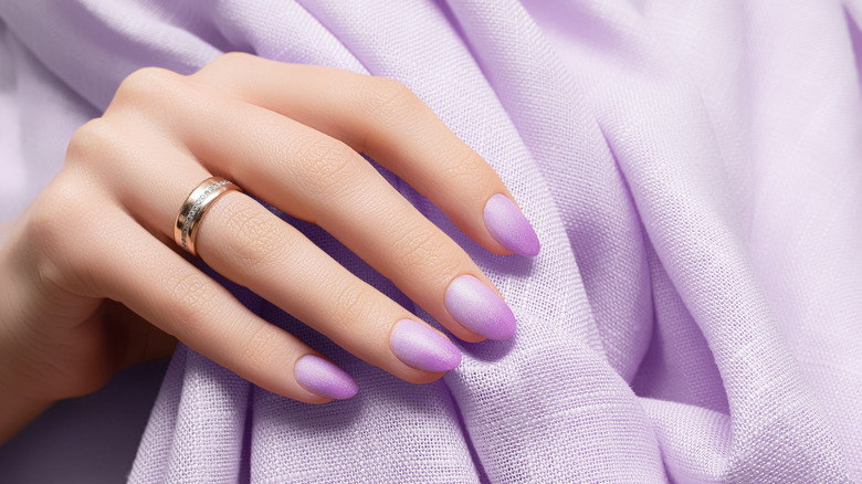 hand with lavender nails