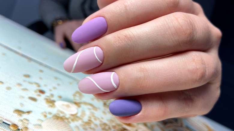 hand with lavender nails