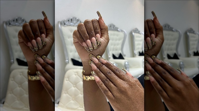 Woman with gold tip nails