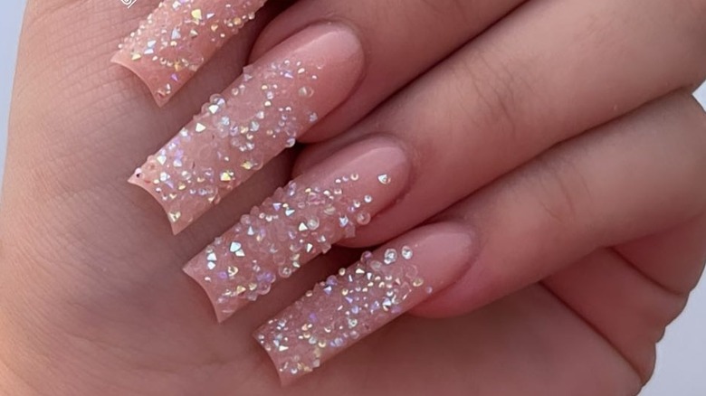 Woman with rhinestones on her nails