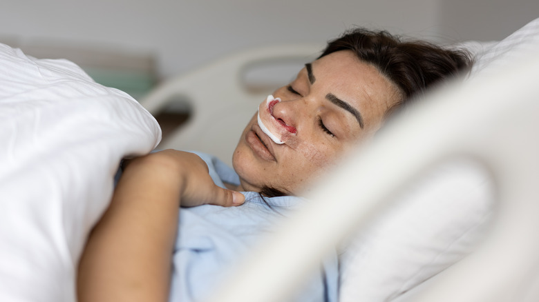 woman in bed recovering from surgery