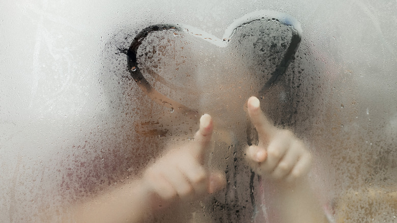 Drawing heart on shower mirror