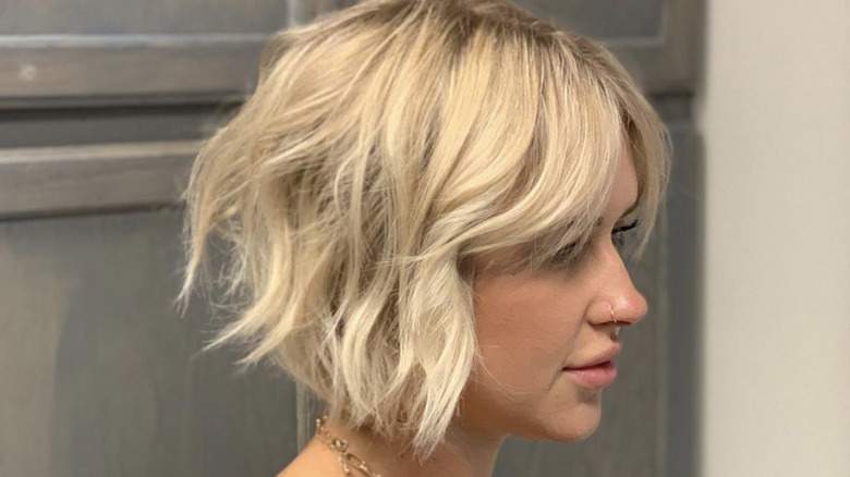 Woman with short blonde textured bob