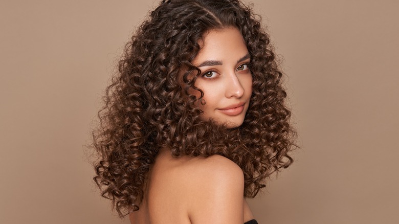 Woman with curly, voluminous hair