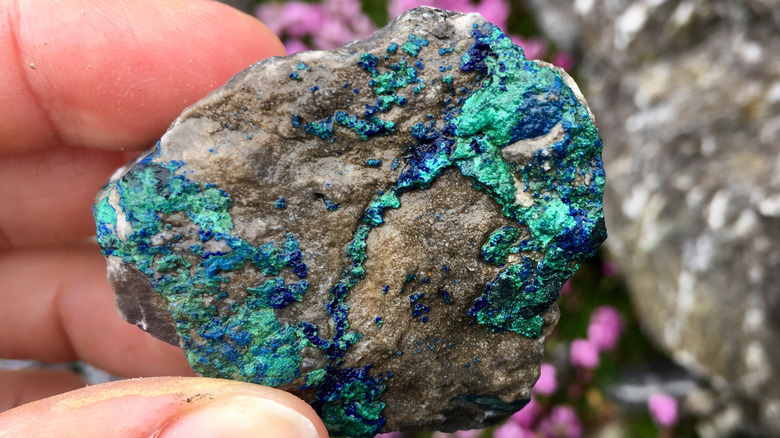 hand holding raw azurite