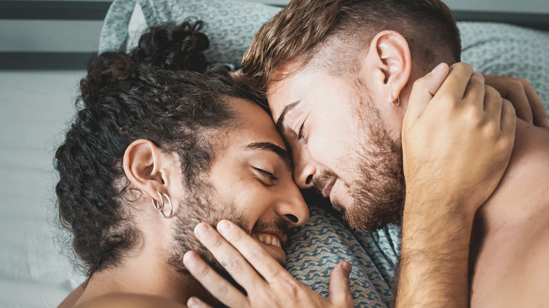 two men in bed