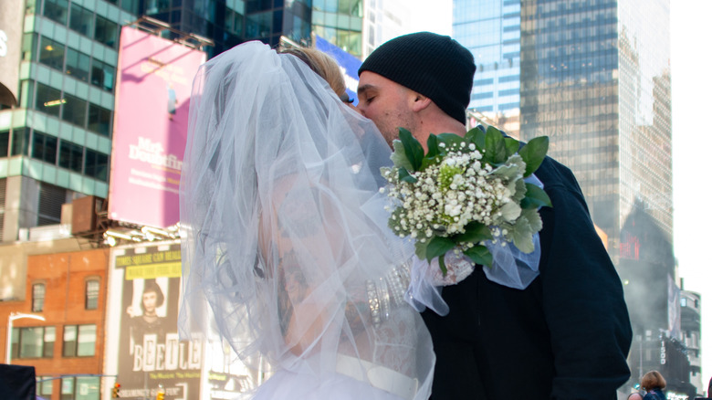 eloping couple during street wedding