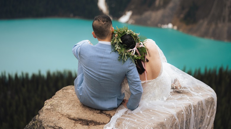 Bride and groom cuddling