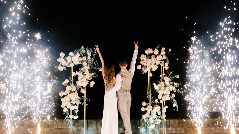 Bride and groom amid sparklers