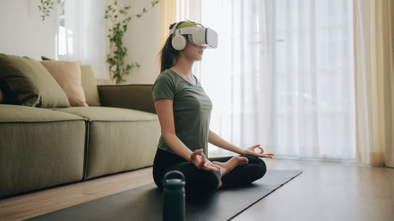 wearing VR headset on yoga mat