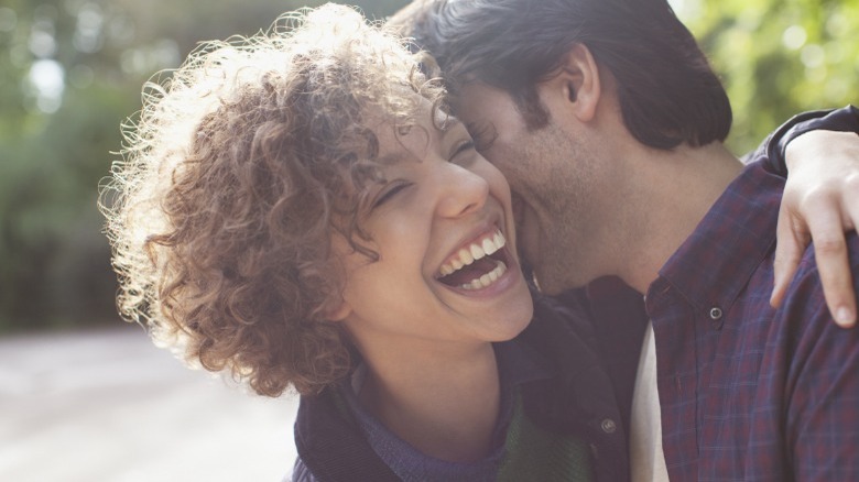 Girlfriend laughing with her boyfriend