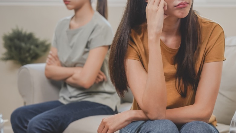 Upset couple sitting down