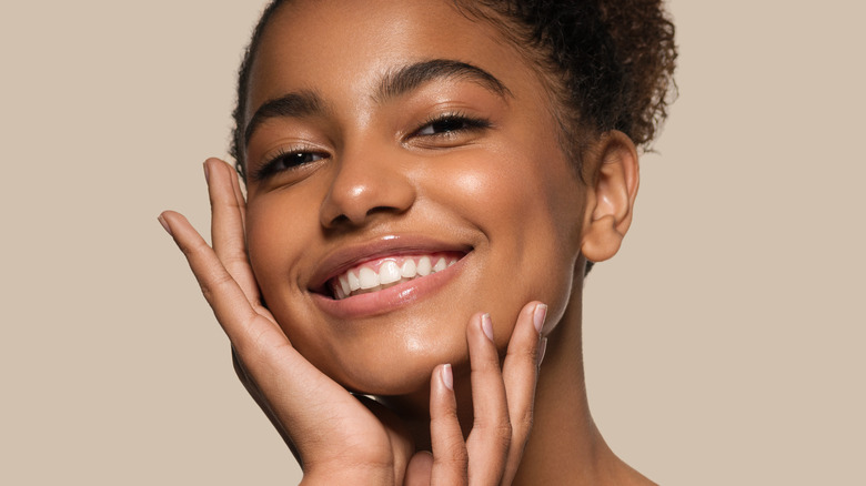 woman with healthy skin smiling