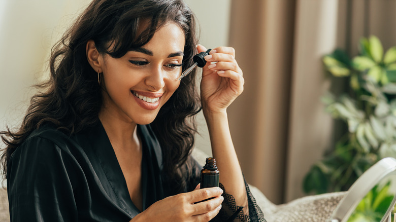 Woman applying hyaluronic acid