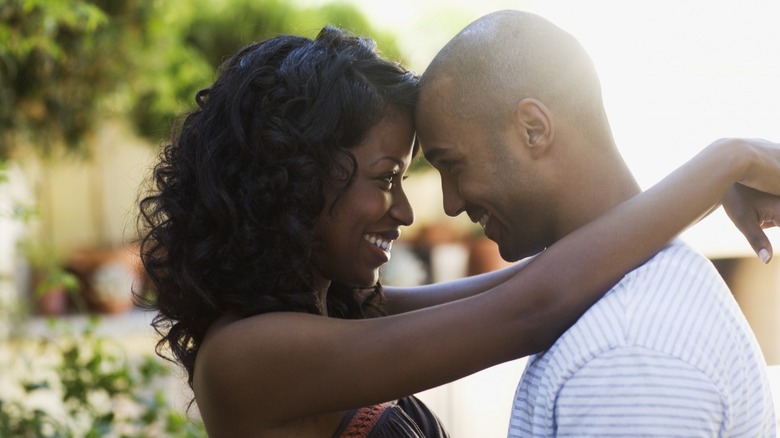 Couple smiling and hugging