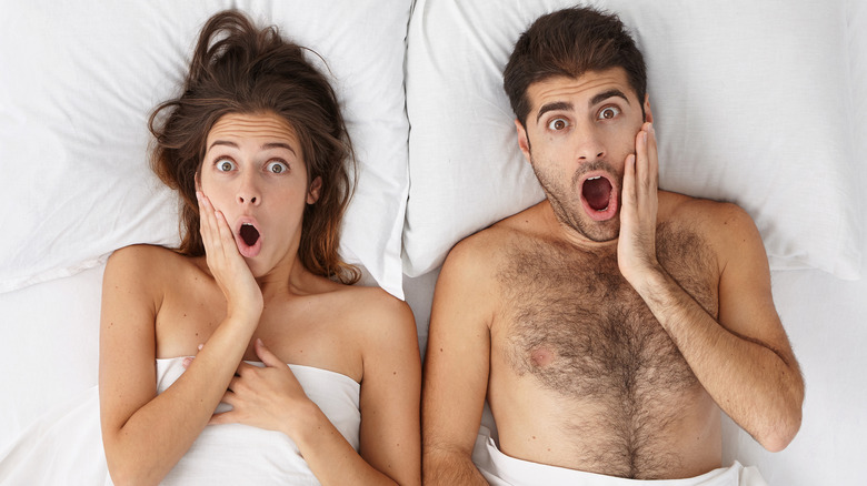 couple in bed screaming