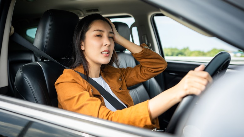 woman in her car