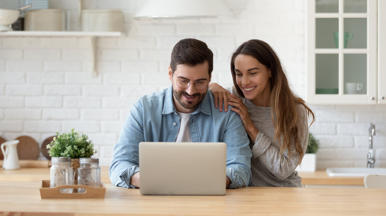 Couple looking at computer together