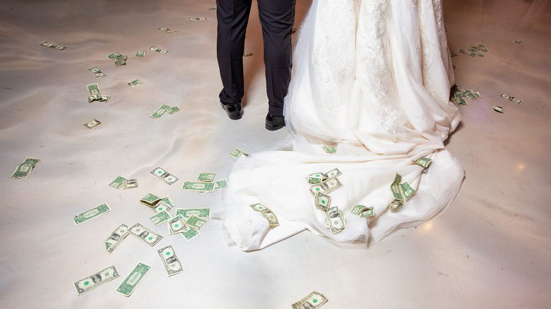 money on floor at wedding