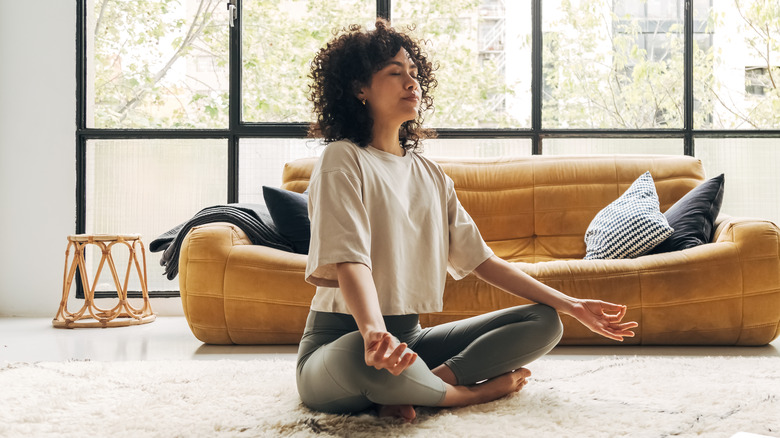 woman meditating at home