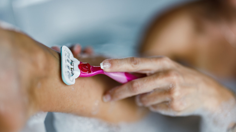 close up at woman shaving