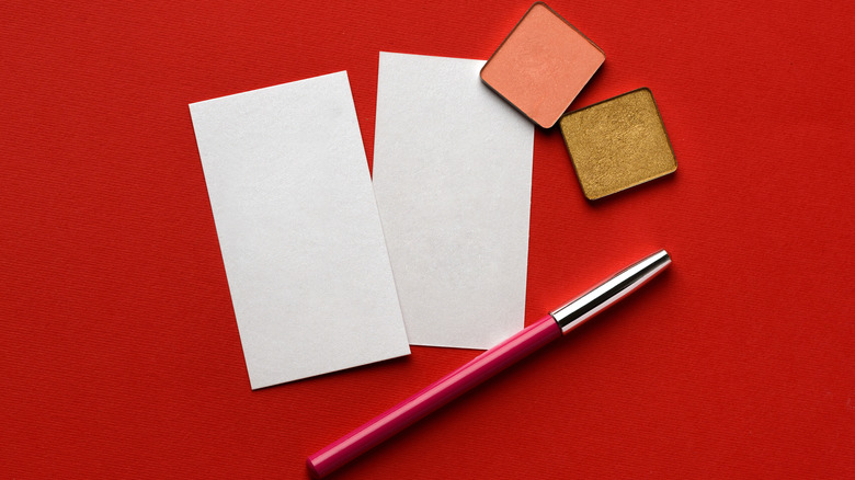 eyeliner, eyeshadow, and business cards