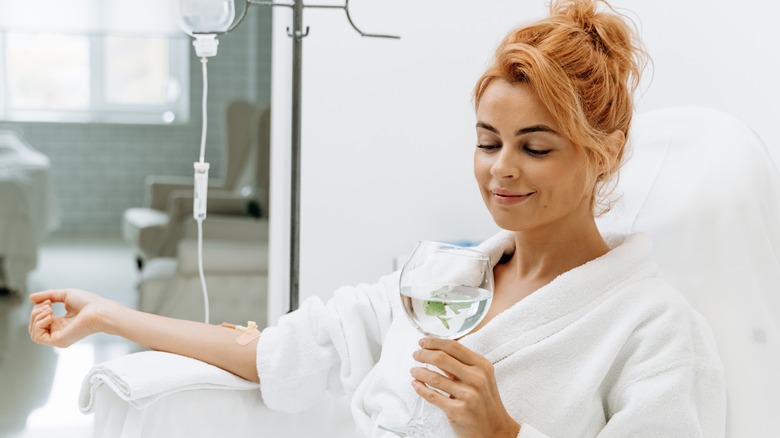 young woman smiling IV therapy