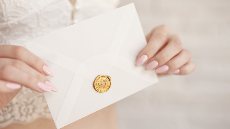 person holding congratulations card