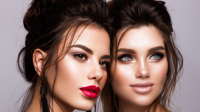 two women wearing different lipsticks