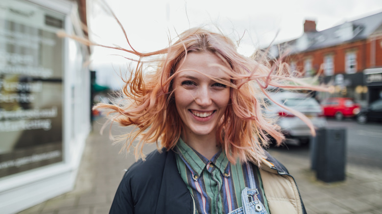 Smiling woman on street