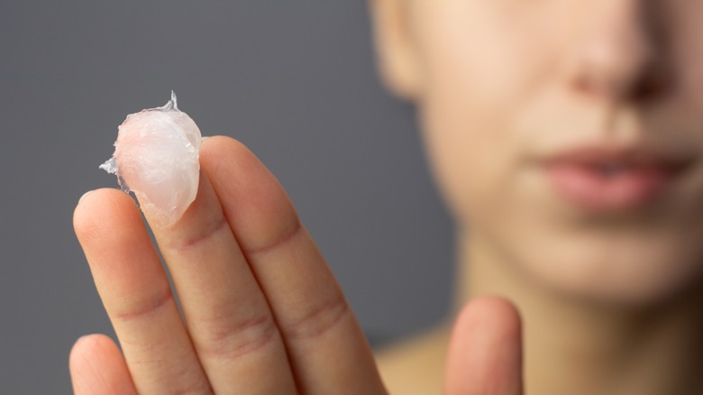 Woman with vaseline on fingers 