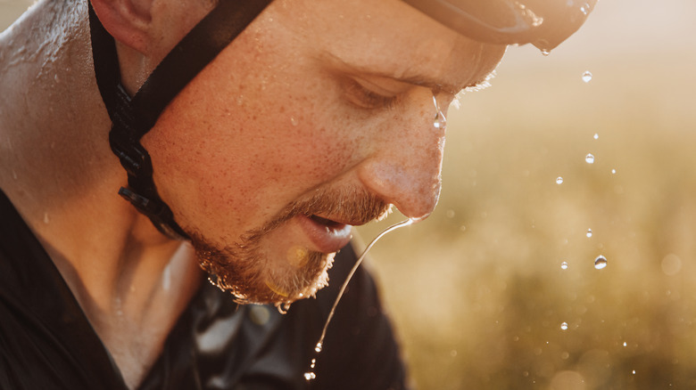 biking man sheds splashes of sweat
