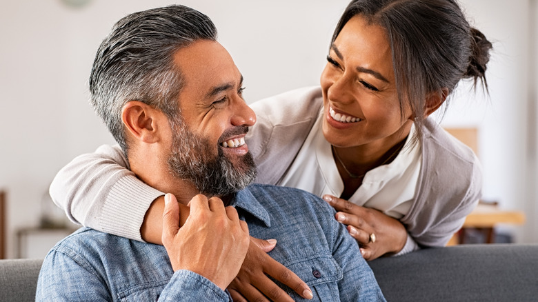 a couple laughing at each other