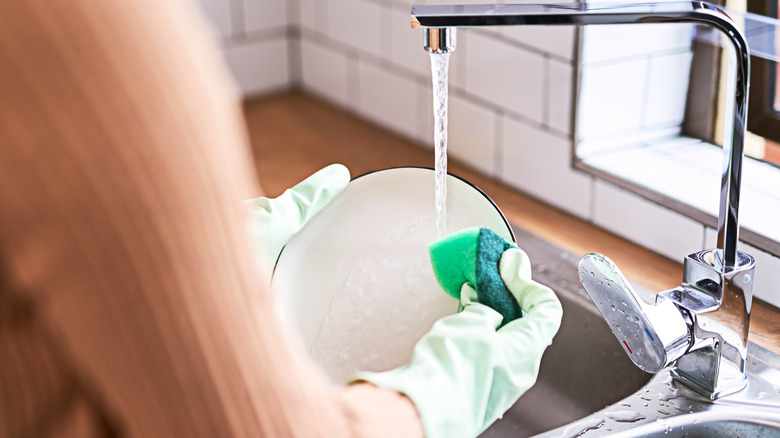 washing dishes with gloves