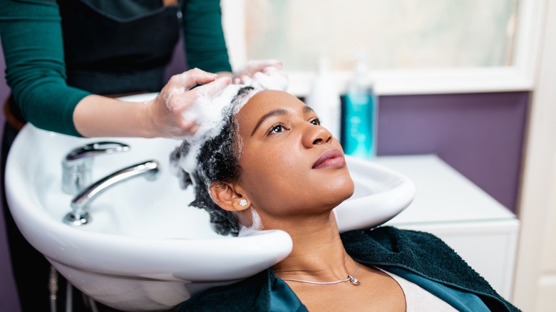 Woman getting hair detox treatment