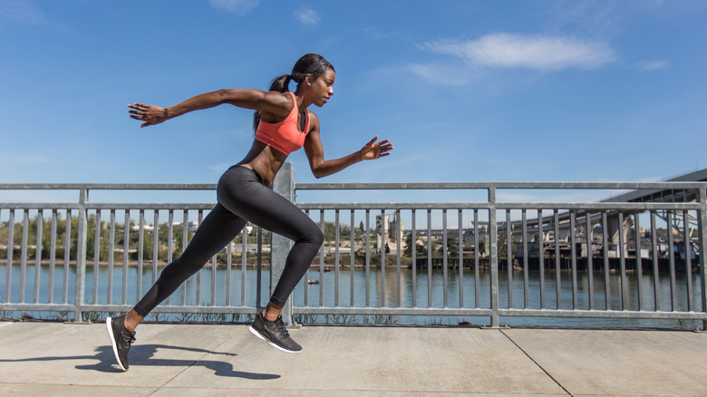 Woman running in city