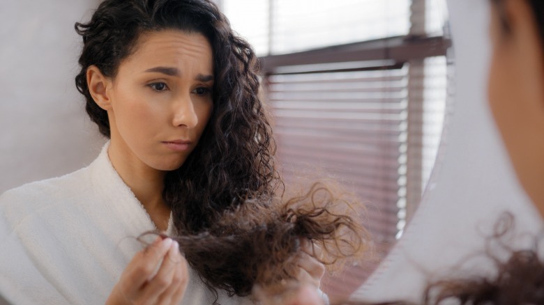 Woman with curly damaged hair