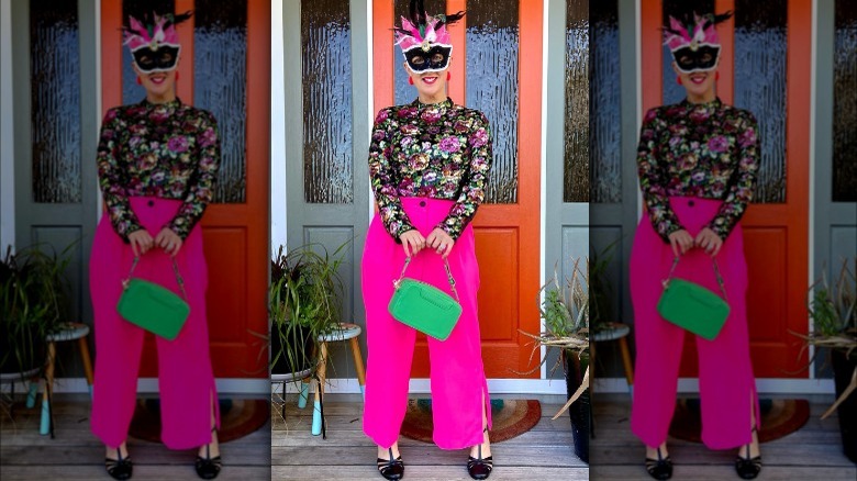 woman wearing neon pink pants and flowered print shirt