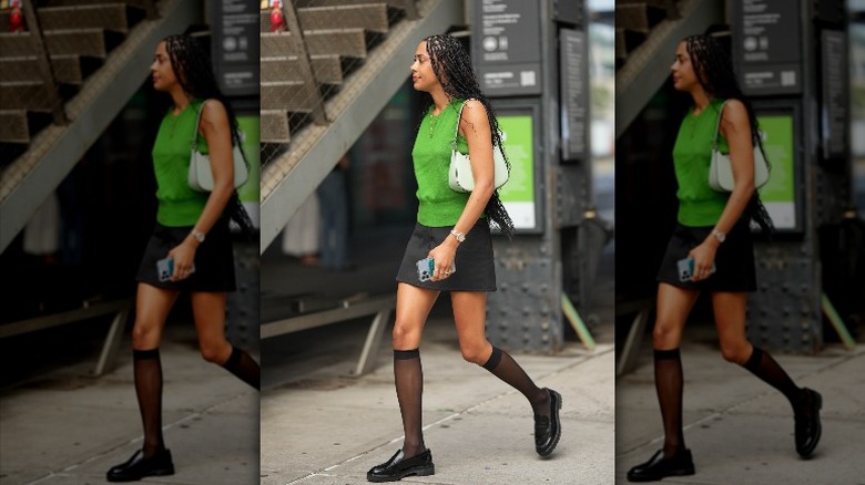 woman with sheer socks and loafers