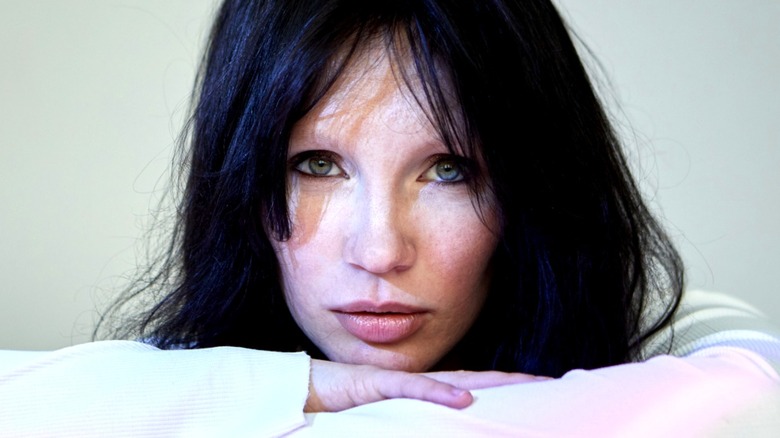 Closeup of a woman with no eyebrows.