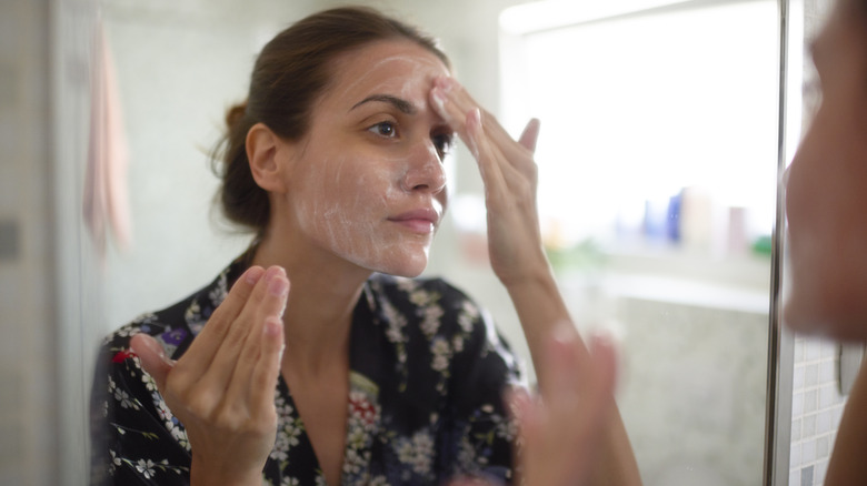 Woman washing her face