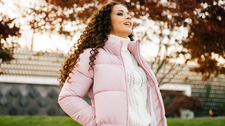 Woman wears big, down jacket 