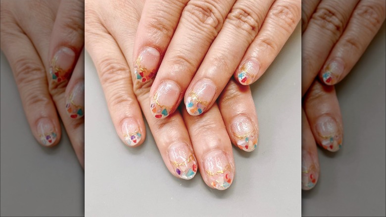 Nude nails with colorful gems 