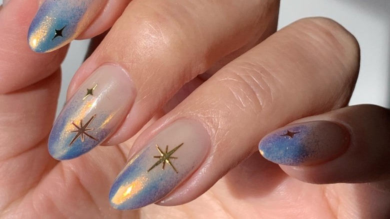 Silver, blue star nail design